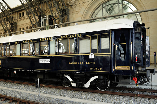 Stopover of the Orient Express at a train station. The Orient Express was a long-distance train established by the Compagnie Internationale des Wagons-Lits (CIWL). It was originally a luxury train composed only of sleeping and dining cars, which first ran from Paris to Constantinople (since 1930 Istanbul) on June 5, 1883. In 2009, the Orient Express ceased operations.