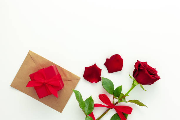 istock Red rose with a ribbon, love letter and red box. 1293442279