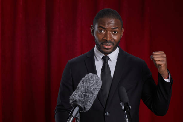 istock African-American Motivational Speaker on Stage 1293444852