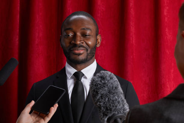 istock African-American Man Giving Interview to Journalists 1293444884