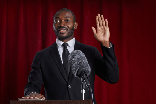 istock African-American Man Speaking at Podium 1293444888