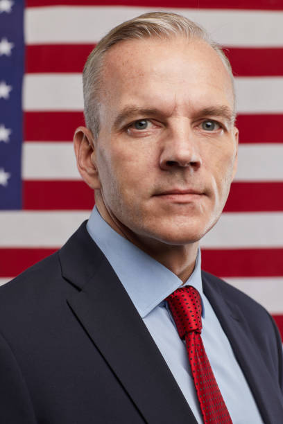 istock Successful Mature Man against American Flag 1293444900