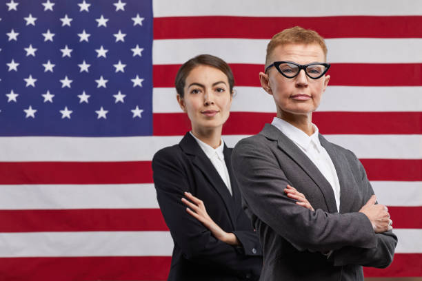 istock Two Female Leaders against American Flag 1293444918