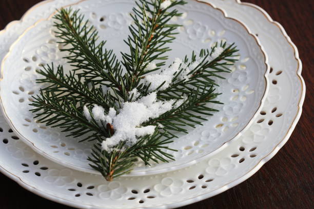 istock Festive Christmas table setting, table decoration with fir branches, woodene background 1293446646