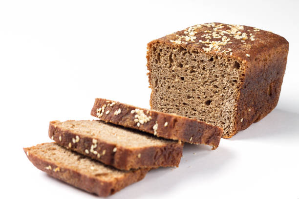 istock Rye bread with sesame seeds, slices on flour sourdough on a white background. 1293446872