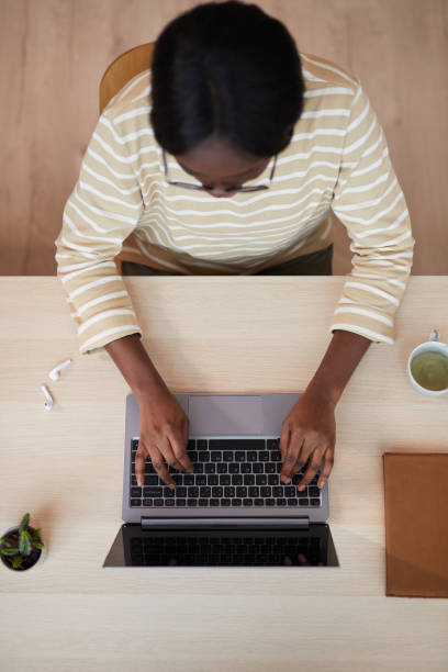 istock African-American Woman Using Laptop Top View 1293446899