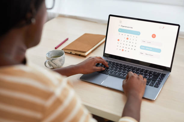istock Young African-American Woman Using Time Managing App 1293446902