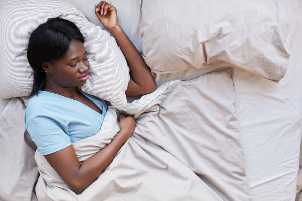 istock African-American Woman Sleeping Top View 1293446918