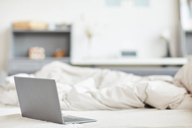 istock Minimal Background of Laptop on Bed 1293446950
