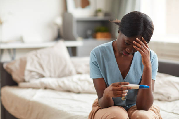 istock Young Woman Holding Pregnancy Test 1293446955
