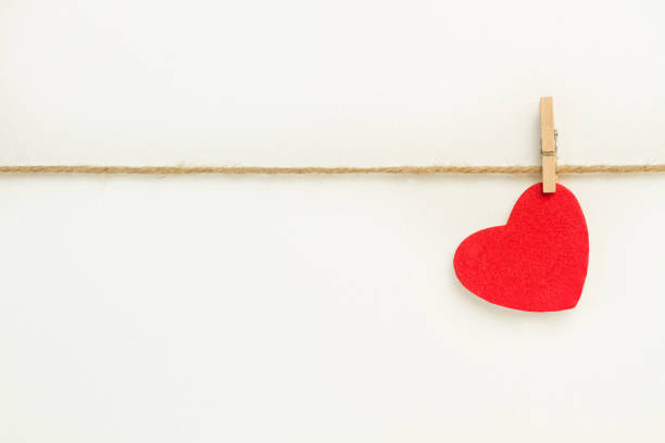istock A red paper heart hanging from a sisal yarn 1293448323