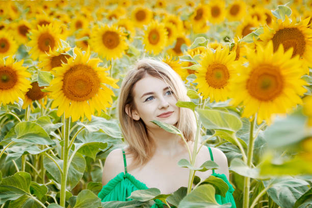istock girl in sunflowers 1293450143