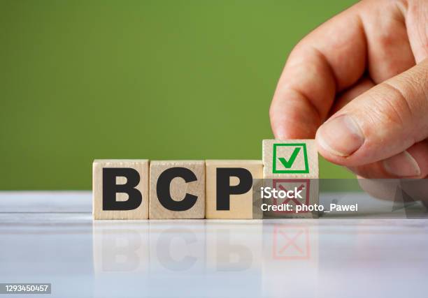 Hand Turn Wooden Block With Red Reject X And Green Confirm Tick As Change Concept Of Bcp Word Bcp Conceptual Symbol Stock Photo - Download Image Now