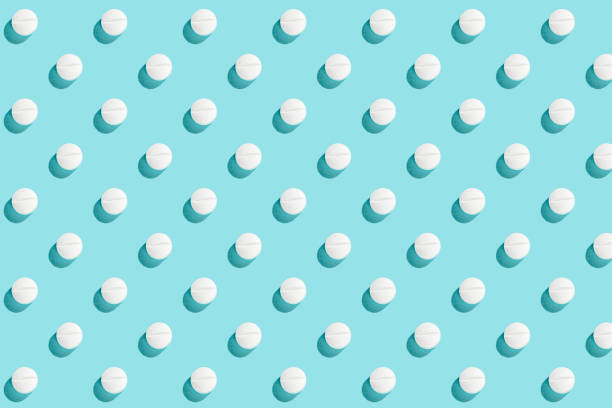istock Trendy pattern with medical pills and tablets on light blue background, copy space. Medicine creative concept. Minimal style. Top view, flat lay 1293450501