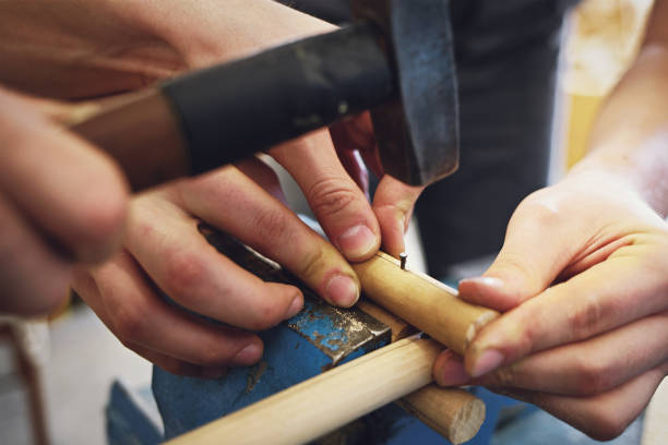 istock Handmade in a carpenter's workshop. Male hands close up while working. 1293451298