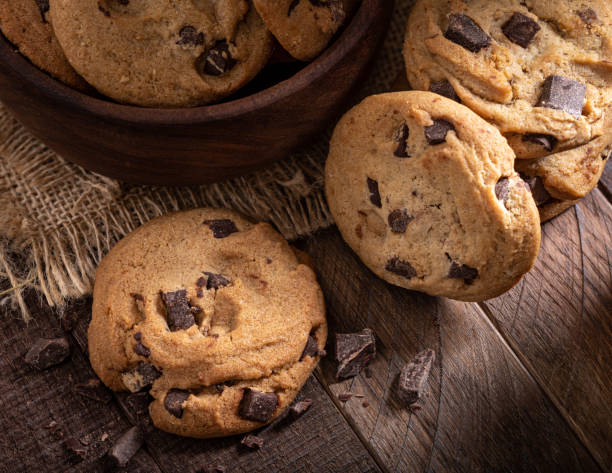 istock Chocolate Chip Cookies on a Wooden Table 1293454043