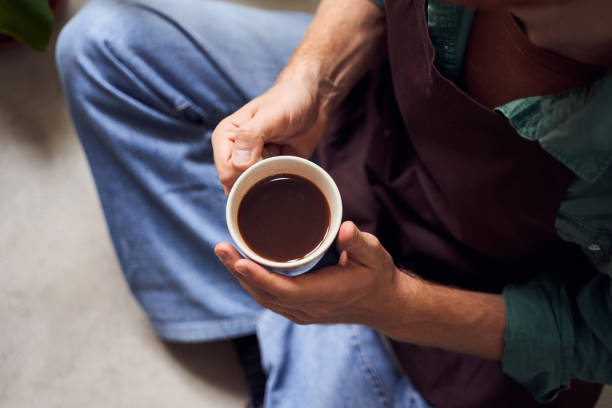 istock Top view of man on chair drinking coffee 1293454773