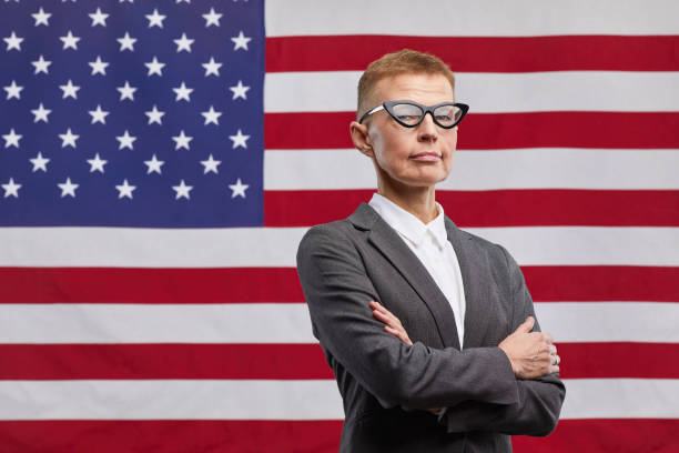 istock Mature Female Leader against American Flag 1293457122