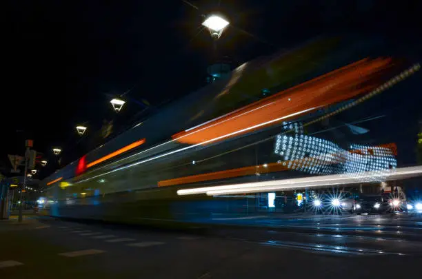 Moving tram in the city center of Graz, Styria region, Austria, by night