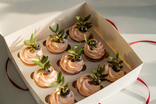 istock Festive box of pink cupcakes 1293457296