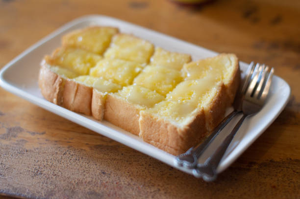 istock Bread with butter and sugar on a white plate 1293458372