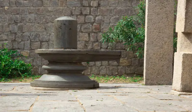 Photo of A Divine view of the Sacred Stone Shiva Lingam usually placed in a Hindu temple for worshiping by the devotees.