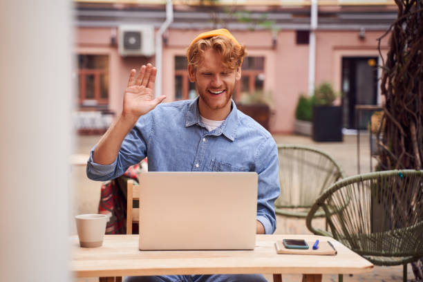 istock Low angle shot of  handsome man working on laptop 1293458489