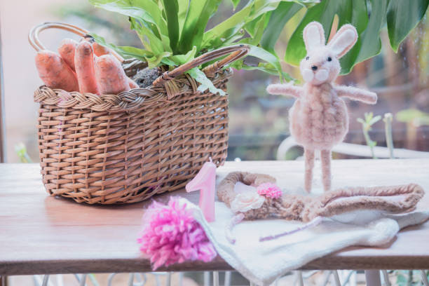istock Setting for a baby birthday with Easter decoration. 1293459612