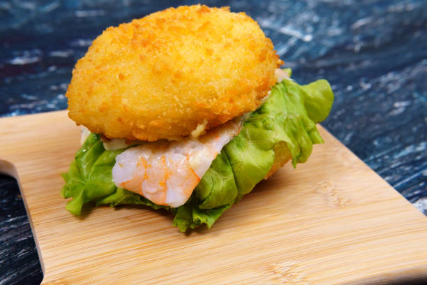 istock fried Burger with shrimp and salad, with space to copy text 1293459898