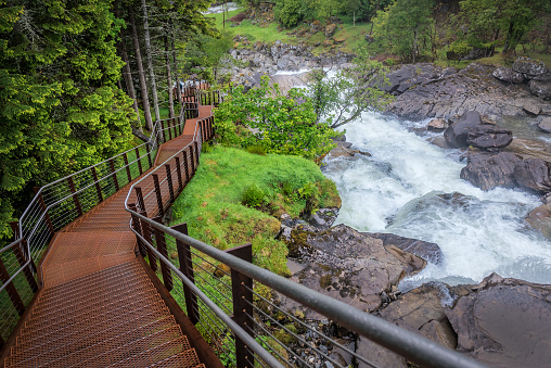 metal stairs and mountain stream and waterfall