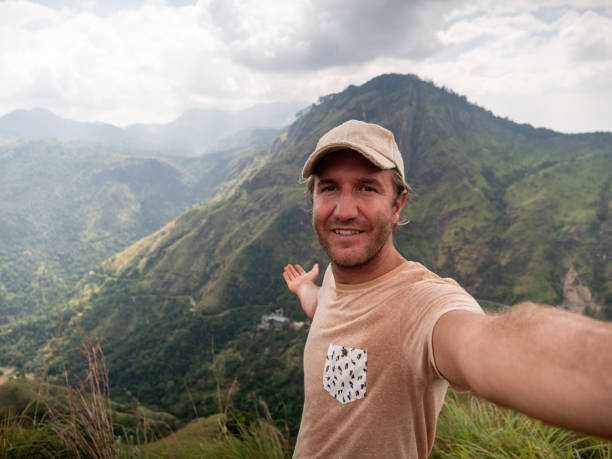 istock Man takes selfie photo on mountain top 1293460631