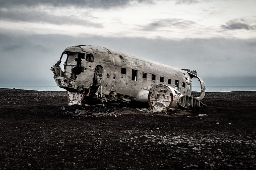 Photo of an American plane wreck on a black sand beach in the middle of Iceland