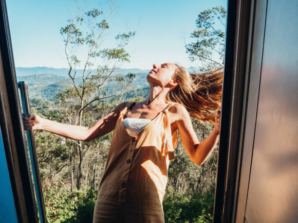 istock Woman hangs on doors in a moving train, Sri Lanka 1293461156