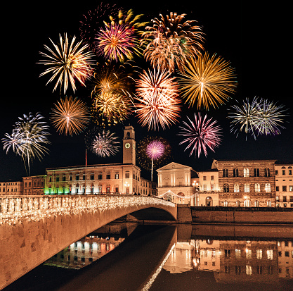 pisa by night with new year fireworks