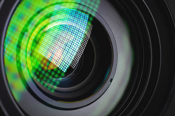 istock Close-up of a camera mirror lens front lens with aperture and highlights from a light source 1293462500