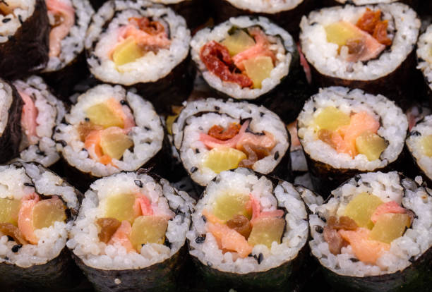 istock Top view of stack of Japanese sushi maki roll plate. 1293462555