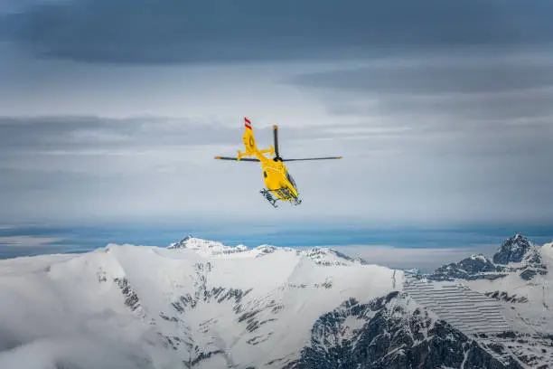 rescue helicopter in winter landscape at Hintertux glacier in Zillertal