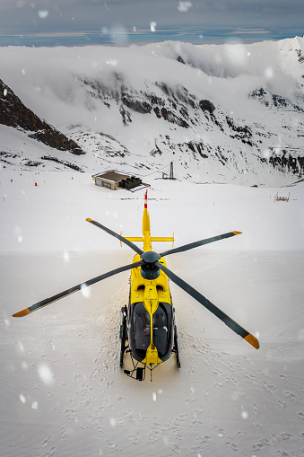 Just landed rescue helicopter in winter landscape at Hintertux glacier in Zillertal