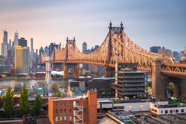 New York City Skyline from Queens Queens, New York, USA view with the Queensboro Bridge towards Manhattan at dusk. borough district type photos stock pictures, royalty-free photos & images