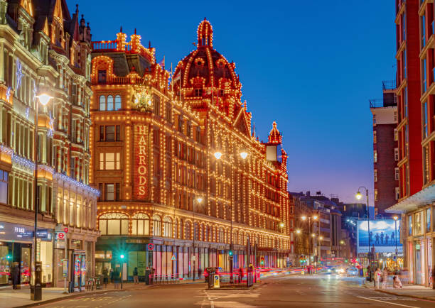 London, England, UK - December 27, 2020: The famous luxury department shopping store Harrods in London illuminated in Christmas lights