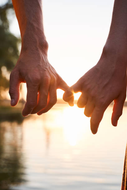 istock Lovers holding on to their little fingers 1293470225