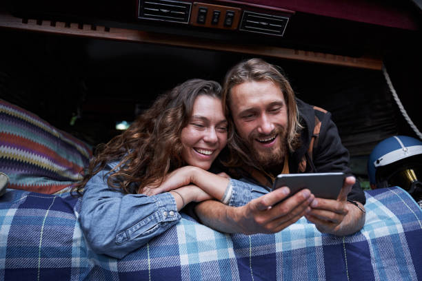 istock Couple watching funny video 1293470278