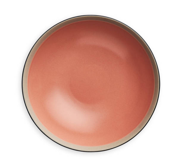 istock Empty ceramics plates, Classic coral pink plate isolated on white background with clipping path, Top view 1293471092