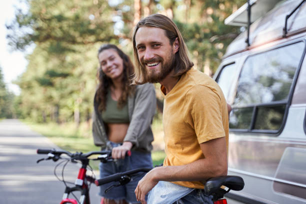 istock Couple standing with bikes 1293472758