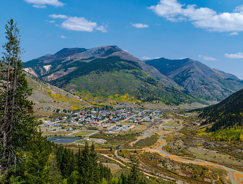 Elevated fall view of Silverton, Colorado nestled among the mountains -  taken from route 550