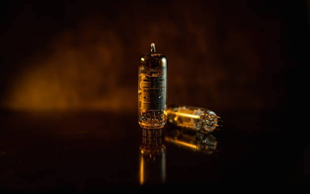 istock Guitar amplifier tubes isolated closeup in dark space 1293478627