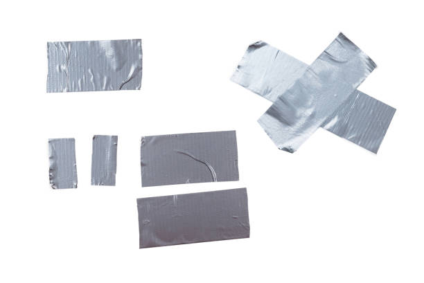 istock Silver scotch tape pieces isolated on white background. 1293478771