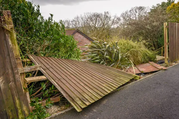 Photo of Wooden fence blown down by strong winds