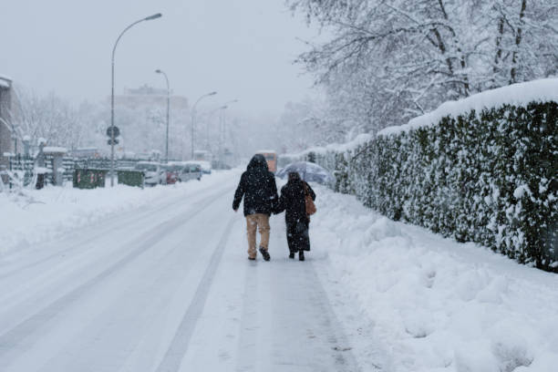 istock Couple walking under the snow 1293481056
