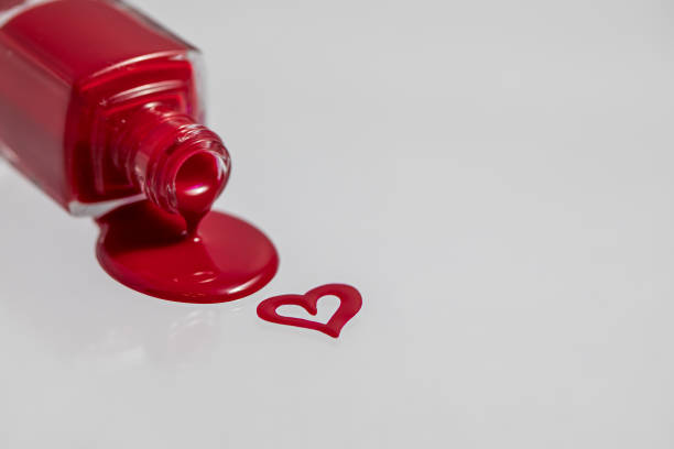 istock An inverted bottle of spilled nail polish. 1293482018